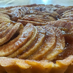 Apple Sourdough Tart – SEBAlicious™ Artisan Dessert (Des Plaines, IL) - Artisan Real Sourdough Bread Chef SebaArtisan Real Sourdough Bread Chef SebaArtisan Real Sourdough Bread Chef SebaSEBA-DS-ASTClose - up of artisan apple tart with thinly sliced caramelized apples and flaky golden crust by Chef SEBA