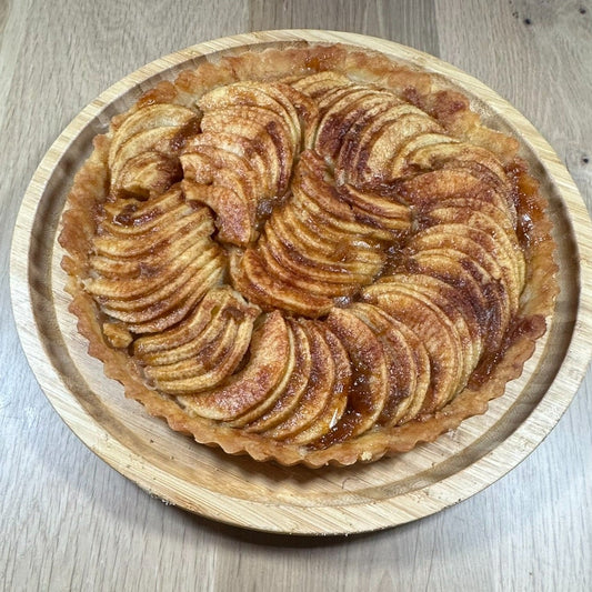 Artisan apple tart with thinly sliced caramelized apples in a golden crust by Chef SEBA in Des Plaines Illinois