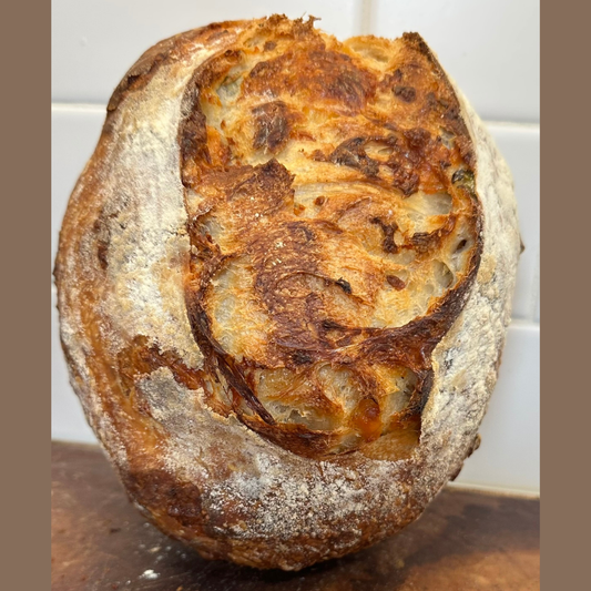 Asiago cheese and onion sourdough bread by Chef SEBA with golden artisan crust