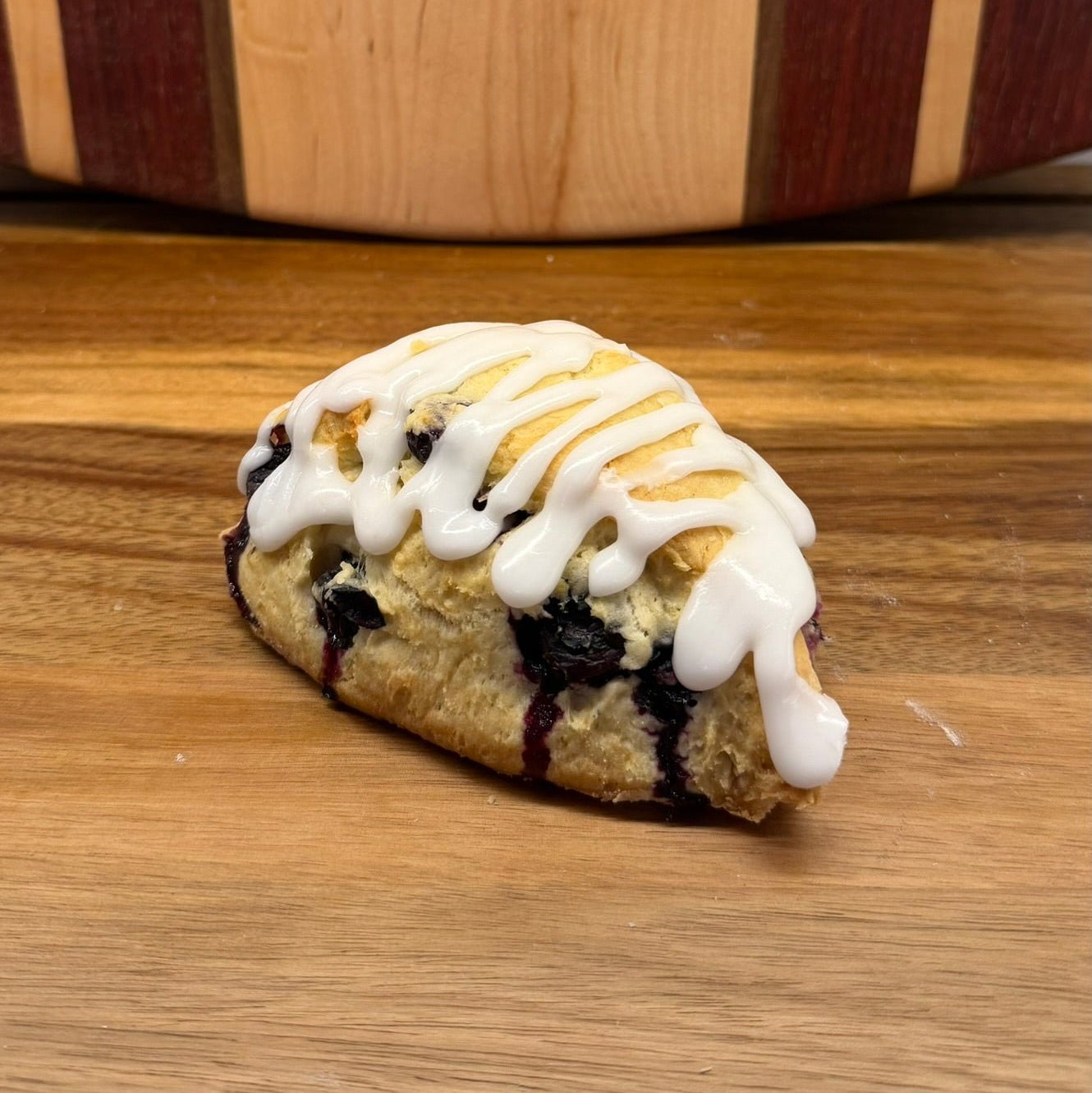 Blueberry Lemon Sourdough Scone – Chef SEBA Artisan Bakery Treat - Artisan Real Sourdough Bread Chef SebaArtisan Real Sourdough Bread Chef SebaArtisan Real Sourdough Bread Chef SebaSEBA-SCO-BLS-001BLUE-SCONE-01singleFresh baked blueberry lemon sourdough scone served on a plate with coffee, showcasing artisan bakery presentation by Chef SEBA.