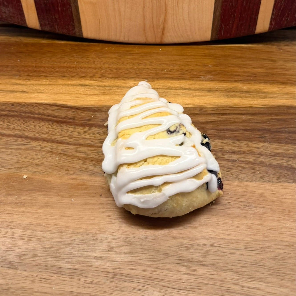 Blueberry Lemon Sourdough Scone – Chef SEBA Artisan Bakery Treat - Artisan Real Sourdough Bread Chef SebaArtisan Real Sourdough Bread Chef SebaArtisan Real Sourdough Bread Chef SebaSEBA-SCO-BLS-001BLUE-SCONE-01singleFreshly baked batch of blueberry lemon sourdough scones showing artisan quality, golden crust, and small - batch baking by Chef SEBA.