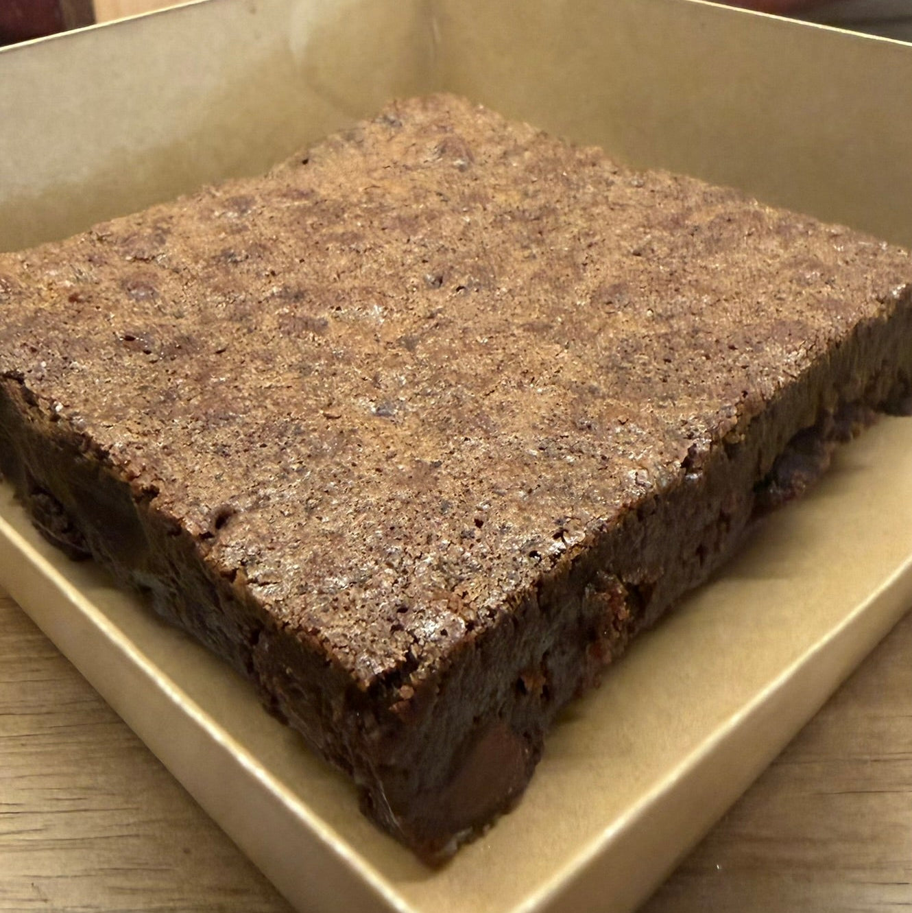 Close-up of chocolate chip sourdough brownie by Chef SEBA showing fudgy interior and melted chocolate chips in Des Plaines Illinois