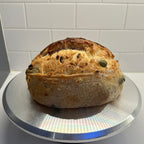 Green Olive Artisan Sourdough Bread – Chef SEBA Organic Vegan Loaf (Mediterranean Style, Naturally Fermented) - Artisan Real Sourdough Bread Chef SebaArtisan Real Sourdough Bread Chef SebaArtisan Real Sourdough Bread Chef SebaSEBA-BRD-OLV-WHLMED-ROLL-01Whole LoafSliced green olive sourdough bread showing open crumb and olive pieces inside