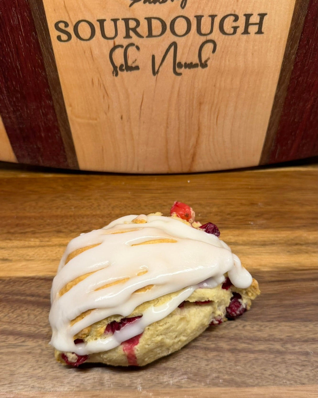 Organic Cranberry Lemon Sourdough Scones – Chef SEBA Artisan Bakery - Artisan Real Sourdough Bread Chef SebaArtisan Real Sourdough Bread Chef SebaArtisan Real Sourdough Bread Chef SebaSEBA-SCON-CRAN-LEM-0011singleCranberry lemon sourdough scone with thick glaze and visible fruit by Chef SEBA artisan bakery