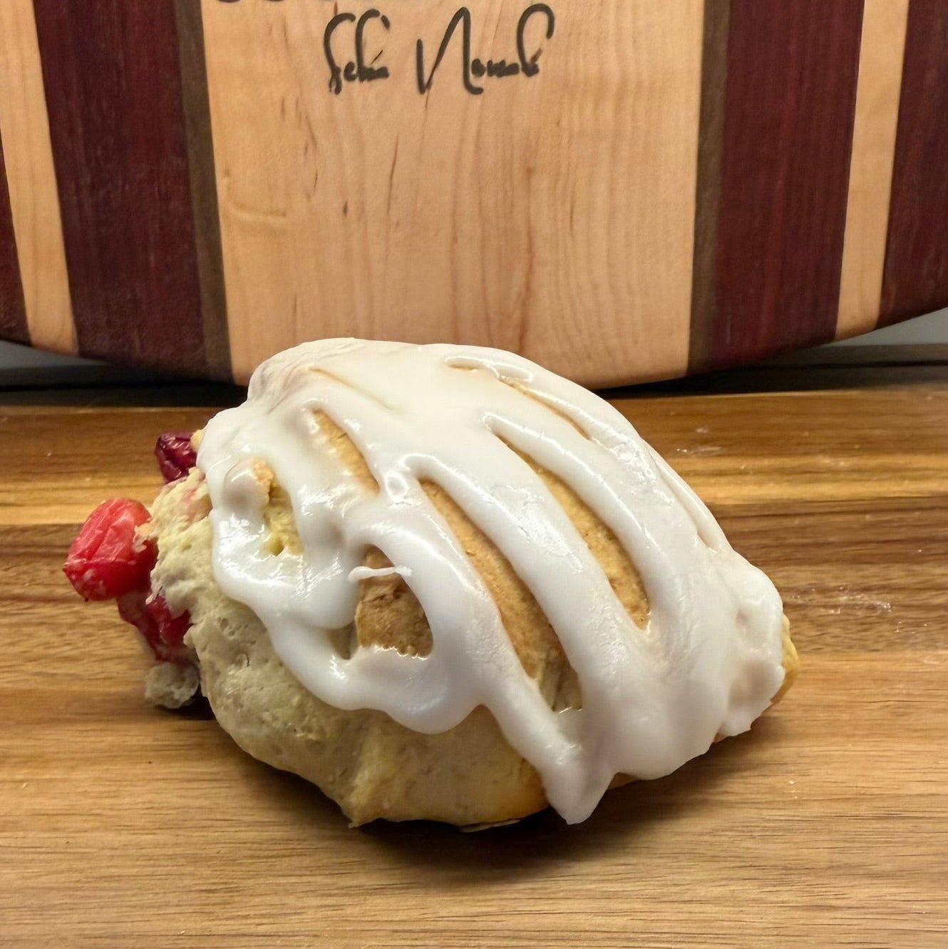 Organic Cranberry Lemon Sourdough Scones – Chef SEBA Artisan Bakery - Artisan Real Sourdough Bread Chef SebaArtisan Real Sourdough Bread Chef SebaArtisan Real Sourdough Bread Chef SebaSEBA-SCON-CRAN-LEM-0011singleSide view of cranberry lemon sourdough scone with thick glaze by Chef SEBA showing texture and artisan crumb