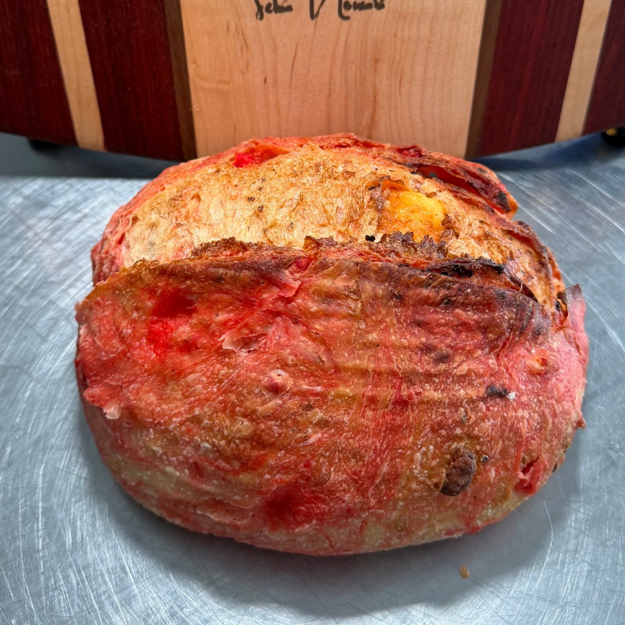 SEBAlicious™ Flamin’ Hot Cheetos Extra Sharp Cheddar Sourdough Bread - Artisan Real Sourdough Bread Chef SebaArtisan Real Sourdough Bread Chef SebaArtisan Real Sourdough Bread Chef SebaWhole LoafWhole Flamin Hot Cheetos artisan sourdough loaf with crispy crust