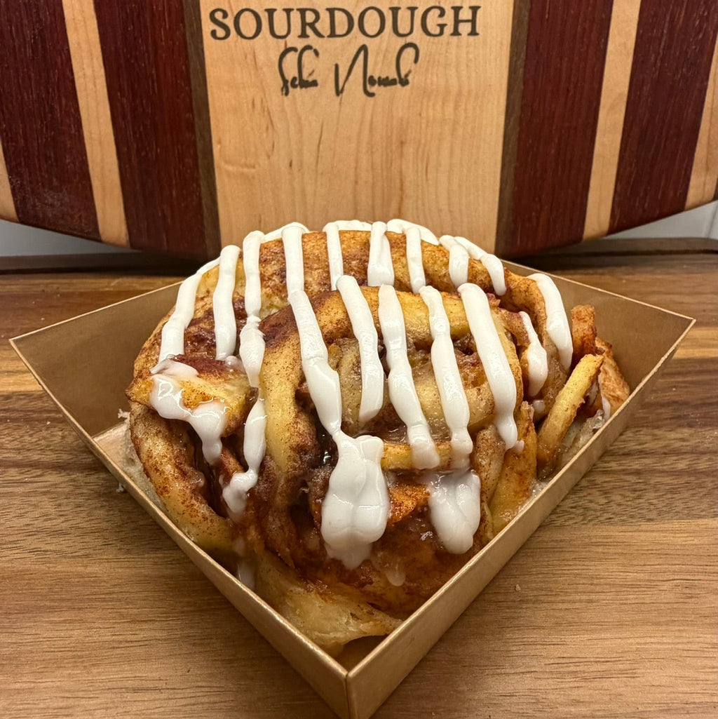 Close up sourdough apple roll with cinnamon apples and lemon icing drizzle by Chef SEBA in Des Plaines Illinois