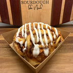 Close up sourdough apple roll with cinnamon apples and lemon icing drizzle by Chef SEBA in Des Plaines Illinois