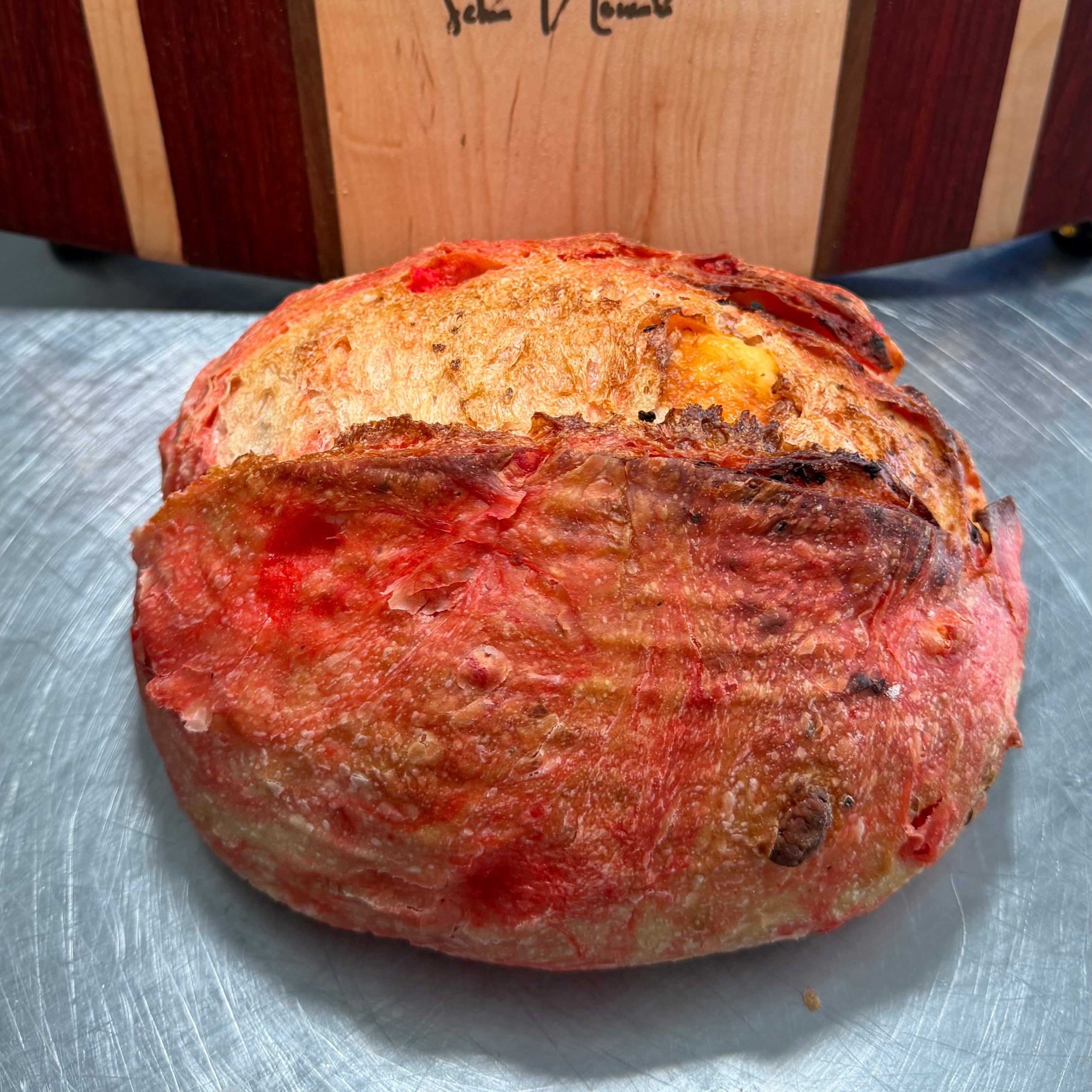 Whole Flamin Hot Cheetos artisan sourdough loaf with crispy crust